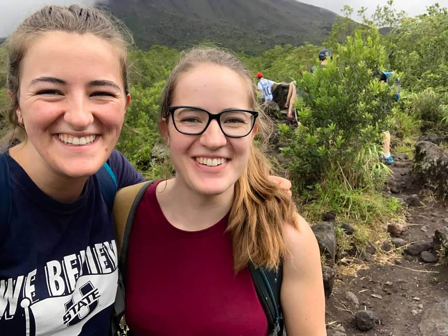 two tourists posing for a photo on the old lava trails at Arenal Volcano National Park