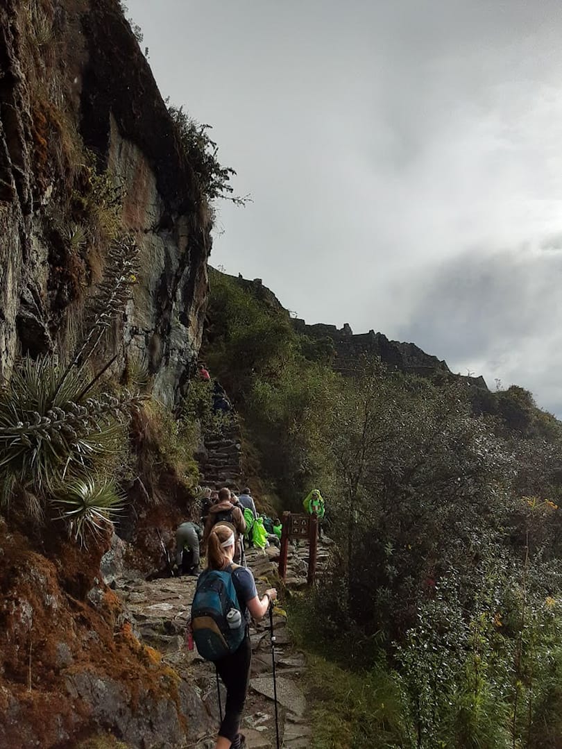 hikers climbing stairs on the Inca Trail